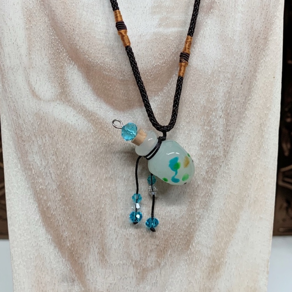 Elegant Glass Pendant Necklace with Blue Bottle Charm for Essential Oils